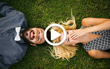 man-woman-laughing-in-grass image