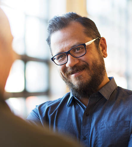 Office working listening to a co-worker talk