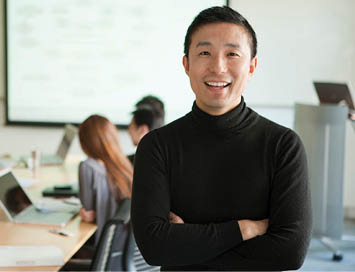 Office working smiling looking at camera