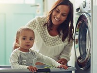 mom with kid in laundry room